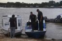 Federal police officers arrive at the pier after searching for Indigenous expert Bruno Pereira and freelance British journalist Dom Phillips in Atalaia do Norte, Amazonas state, Brazil, Tuesday, June 14, 2022. Brazilian police are still searching for