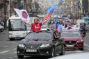 Members of a pro-Kremlin youth organisation ride their cars with flags of Luhansk People Republic along Nevsky prospect, the central avenue of St. Petersburg as they celebrate announced by Russian authorities full control over Luhansk Region, one of the
