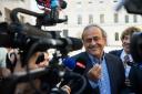 The former president of the the European Football Association (Uefa), Michel Platini, center, surrounded by media representatives, speaks to the press in front of the Swiss Federal Criminal Court in Bellinzona, Switzerland, at the last day of the trail,