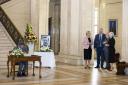 Sinn Fein Vice President Michelle O'Neill, UUP leader Doug Beattie, Assembly Speaker Alex Maskey and the DUP's Joanne Bunting chat as the Alliance's Andrew Muir signs a book of condolence in Stormont. Photo PA.