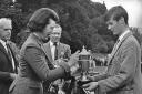 Lady Butter presents a trophy to piper Ian Duncan at the Pitlochry Highland Games in 1968