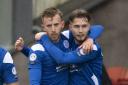 Queen of the South's Ally Roy (left) celebrates with Harry Cochrane after making it 1-1 during the SPFL Trust Trophy Final between Raith Rovers and Queen of the South at the Penny Cars Stadium