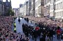 The procession of Queen Elizabeth coffin from the Palace of Holyroodhouse to St Giles Cathedral moves along the Royal Mile in Edinburgh, Scotland. Monday September 12, 2022. Photo PA.