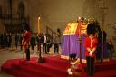 The guard was standing at the foot of the late monarch’s casket when he suddenly fell to the floor