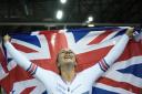 Neah Evans celebrates winning the points race at the Track World Championships in France