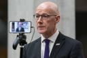 Deputy First Minister John Swinney speaking to the media after delivering statement to the Scottish Parliament earlier this month in which he announced a £400m cut in health and social care spending