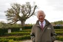 The King in the garden of Dumfries House during a visit there last year when he was Prince of Wales