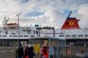 Passengers wait to board the CalMac ferry, Caledonian Isles at  Ardrossan bound for Brodick on Arran. Photograph by Colin Mearns.29 November 2022.