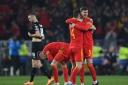 Wales' Ben Davies and Chris Mepham celebrate at the final whistle during the FIFA World Cup Qualifier Semi-final match at Cardiff City Stadium, Cardiff
