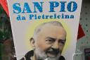 San Giovanni Rotondo, ITALY:  Picture taken 16 March 2006 of books telling the Padre Pio's life in a souvenirs' shop in San Giovanni Rotondo.   AFP PHOTO / MARIO LAPORTA  (Photo credit should read MARIO LAPORTA/AFP via Getty Images).