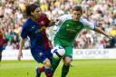 Lionel Messi proved too hot to handle for a young Paul Hanlon in a friendly between Barcelona and Hibernian back in 2008.