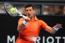 Serbia’s Novak Djokovic makes a forehand return to France’s Quentin Halys