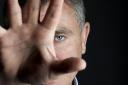 Picture of Andy McNab with his hand masking his face. See PA Feature BOOK Andy McNab. Picture credit should read: Neil Spence/PA. WARNING: This picture must only be used to accompany PA Feature BOOK Andy McNab.