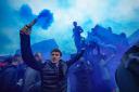 Everton fans set off flares outside the ground ahead of the Premier League match at Goodison Park, Liverpoo