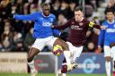 Heart of Midlothian's Lawrence Shankland and Rangers Glen Kamara (left) battle for the ball during the cinch Premiership match at Tynecastle Park