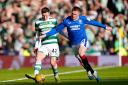 Celtic's Callum McGregor (left) and Rangers' John Lundstram battle for the ball during the Viaplay Sports Cup Final at Hampden