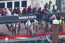 A group of migrants are brought in to Dover on board a Border Force vessel following a small boat incident in the Channel earlier this week