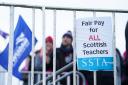 Members of the EIS and SSTA unions on the picket line at St Andrew's and St Brides High School in South Lanarkshire.