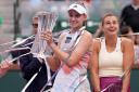 Elena Rybakina lifts the trophy (Mark J. Terrill/AP)