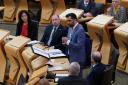 First Minister Humza Yousaf speaking in Holyrood.  Photo PA.
