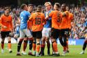 Rangers Todd Cantwell (centre right) and Dundee Utd's Aziz Behich (centre left) clash during the cinch Premiership match