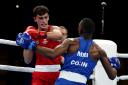 Reese Lynch (red), competes against Louis Richarno Colin from Mauritius on his way to gold at the Commonwealth Games in Birmingham