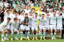 The Celtic squad celebrate their Scottish title win at Tynecastle on Sunday