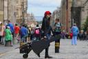 Busker Jennifer Ewan in action on Edinburgh's Royal Mile