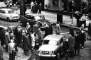 Pedestrians jostle for space with traffic on Buchanan Street in 1963