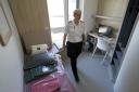 Prison officer inside a room within Iris House during a visit by Justice Secretary Angela Constance