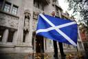 A Scottish independence supporter outside the UK Supreme Court in London on November 23 last years, following the decision by Supreme Court judges that the Scottish Parliament does not have the power to hold a second independence referendum.