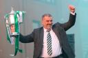 Ange Postecoglou holds the Scottish Cup aloft to Celtic fans at Parkhead last night