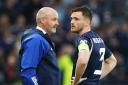 Scotland manager Steve Clarke, left, speaks to his captain Andy Robertson at Hampden last night