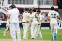 Alex Carey, centre, is congratulated for the wicket of England’s Ollie Robinson (Mike Egerton/PA)