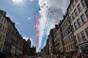 The Red Arrows fly over the Royal Mile