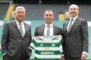 Celtic chairman Peter Lawwell, left, manager Brendan Rodgers, centre, and chief executive Michael Nicholson, right, at Parkhead last month