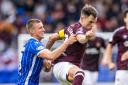 Sam McClelland of St Johnstone, left, battles with Heart striker Lawrence Shankland for the ball  at McDiarmid Park on Saturday