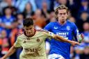 Todd Cantwell of Rangers, right, battles for the ball in the Champions League qualifier against Servette at Ibrox tonight