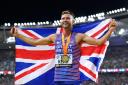 Great Britain’s Josh Kerr celebrates his 1500m title (Martin Rickett/PA)
