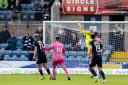 Luke McCowan chips Zander Clark to give Dundee a 1-0 lead over Hearts