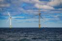 A ship passing wind turbines at RWE's Gwynt y Mor