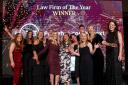 TLT LLP were winners of Law Firm of the Year at the 2022 Herald Law Awards.  Presenting the award is Connie Nimmo, Legal Recruitment Consultant, IDEX Consulting, left and host Jennifer Reoch, far right