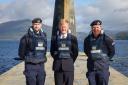 Deputy Prime Minister Oliver Dowden (centre) welcomed the submarine home