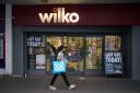 A person passes the Wilko store in Barking, east London, on the final day of its trading and one of the first set of Wilko stores to close down as the dramatic collapse of the high street chain takes shape.