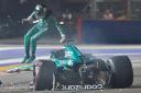 Aston Martin driver Lance Stroll exits his car after crashing in qualifying (Caroline Chia/AP)