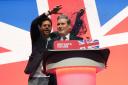 A protestor throws glitter over Labour leader Sir Keir Starmer