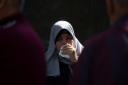 A woman cries during a funeral procession at Al-Shifa Hospital in Gaza City yesterday