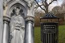 A magnificent cathedral statue in the capital ...and the bin in Queen's Park