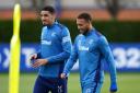 Leon Balogun, left, and Cyriel Dessers chat during Rangers training