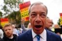 Nigel Farage speaks with protesters outside Downing Street in central London